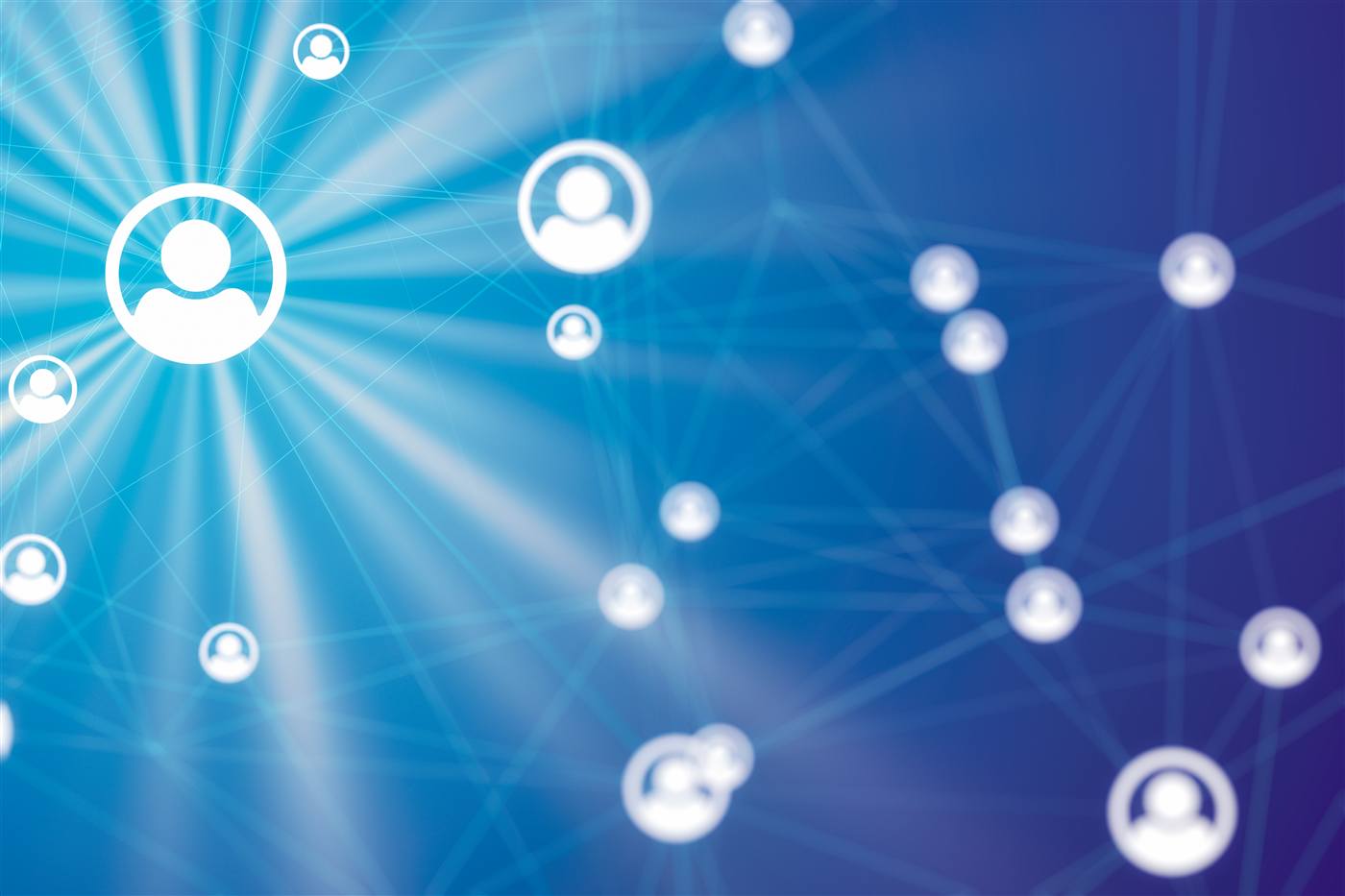 White person-silhouette icons linked by lines on a deep blue background, with light rays emanating from a central focal icon.